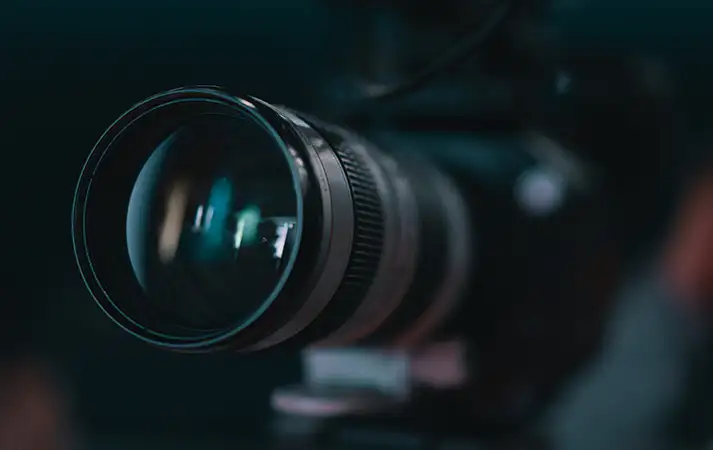 resources video background image thumbnail: picture of a camera lens up close